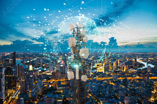 Telecommunication tower with 5G cellular network antenna on night city background, Global connection and internet network concept photo
