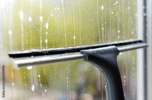 window cleaning with a window cleaning squeegee