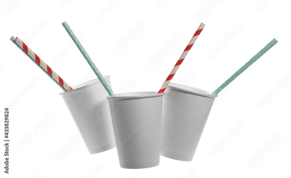 Empty white paper cup with colorful straw isolated on background, clipping path Empty white paper cup with colorful straw isolated on background, clipping path