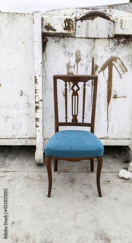 Wooden chair in garbage © celiafoto
