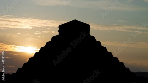 Mayan Pyramid of Kukulcan El Castillo in Chichen Itza, Time Lapse at Sunrise with Colorful Clouds, Mexico photo