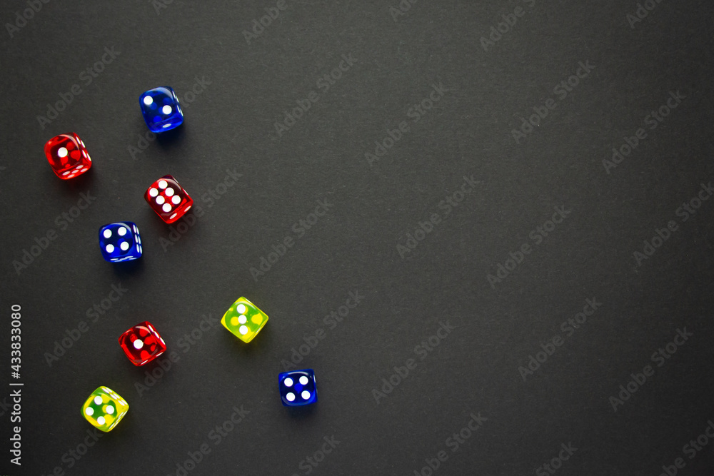 dice red and blue and yellow color black background dice red and blue and yellow color black background