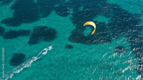 Aerial drone photo of kite surfer practise in tropical exotic island bay with emerald crystal clear sea