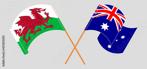 Crossed and waving flags of Wales and Australia