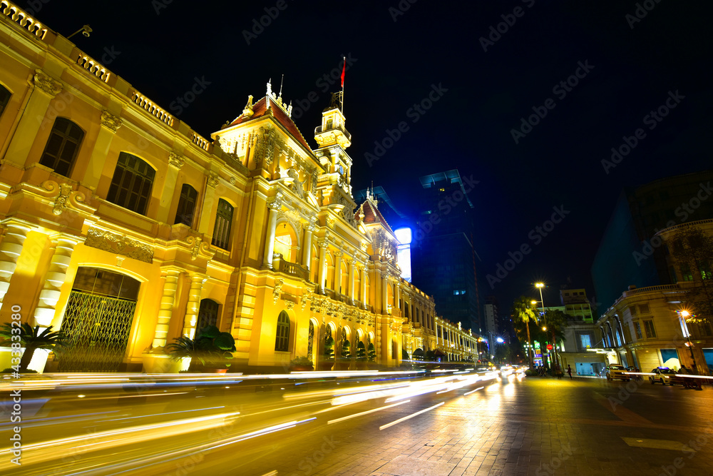 Long exposure shot of the famous and beautiful People's Committee building, also named Hotel de Ville. A French colonial style building in Ho Chi Minh City (Saigon), Vietnam.