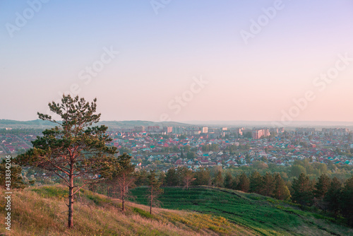 View of the city from the mountain in the evening at sunset.
