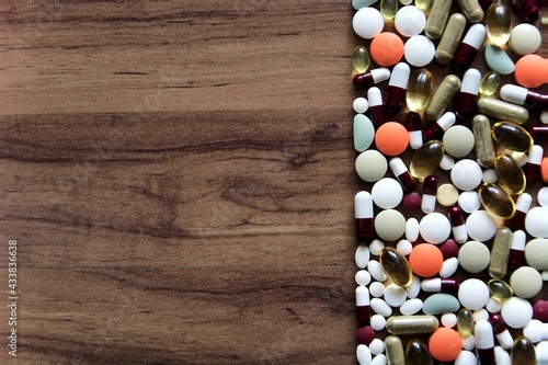 Drugs and medicines on a wooden table