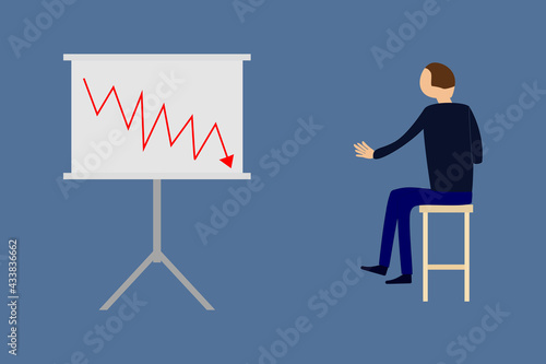 Man sitting on chair viewing a graph with negative growth