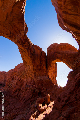 "Double Arch" with blue sky and red sandstone, Archs National Park, Moab, Utah