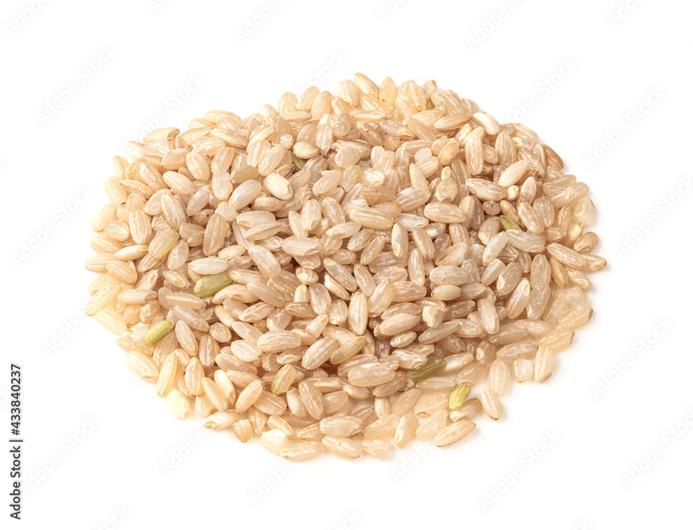 pile of polished brown rice closeup on white pile of polished brown rice closeup on white