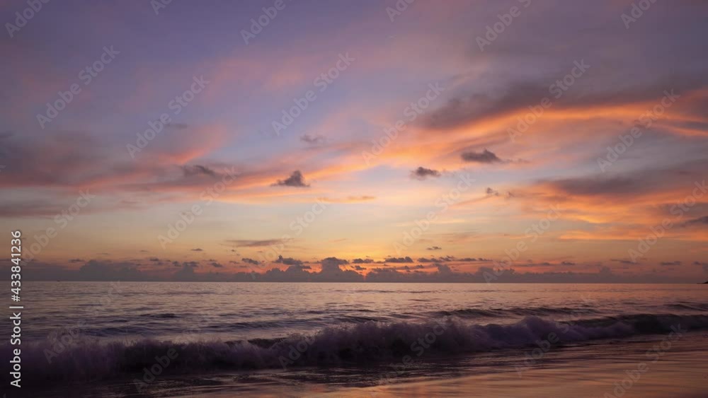 Dramatic sea sunset or sunrise Burning golden sky and shining golden waves Beautiful light reflection on sea surface Amazing landscape 4K footage at Phuket island,Thailand travel background Dramatic sea sunset or sunrise Burning golden sky and shining golden waves Beautiful light reflection on sea surface Amazing landscape 4K footage at Phuket island,Thailand travel background
