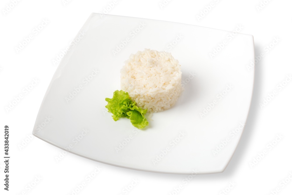 garnish of white rice with herbs. white background and white plate. garnish of white rice with herbs. white background and white plate.
