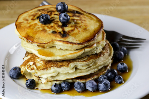 Stack of Blueberry Pancakes with Maple Syrup