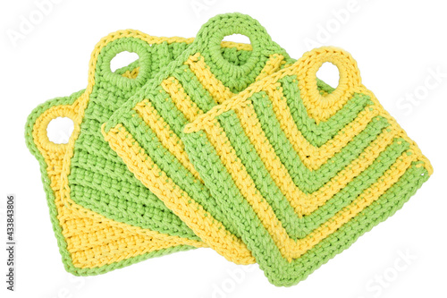 A set of oven mitts for hot dishes, knitted of thick cotton yarn
