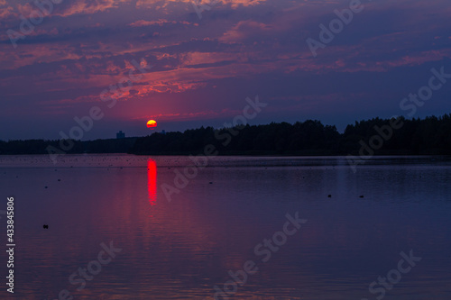 sunset on the lakesunset  water horizonsunris photo