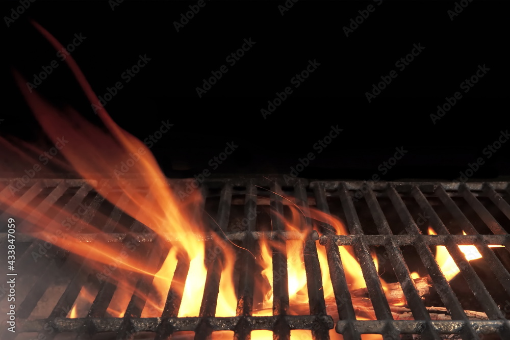 Barbecue Fire Grill Isolated On Black Background. BBQ Flaming Grill Background Isolated. Hot Barbeque Charcoal Cast Iron Grill With Bright Flames. Barbecue Fire Grill Isolated On Black Background. BBQ Flaming Grill Background Isolated. Hot Barbeque Charcoal Cast Iron Grill With Bright Flames.