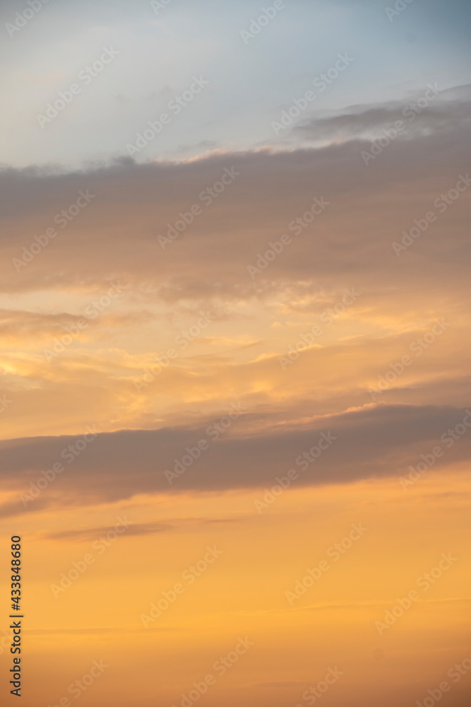 Sunset sky background with dramatic clouds and sunlight, evening sky background