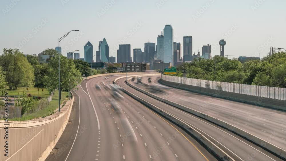 Zooming out of Dallas downtown with highway traffic day time Zooming out of Dallas downtown with highway traffic day time