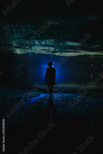 Silhouette of a girl at night.