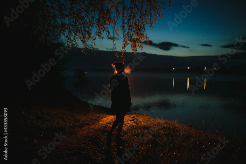 Silhouette of a girl at night.