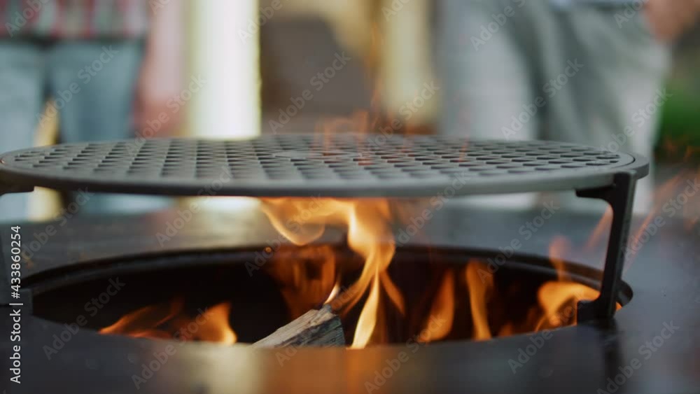 Closeup fire flame on backyard. Bonfire making for preparing food outside Closeup fire flame on backyard. Bonfire making for preparing food outside