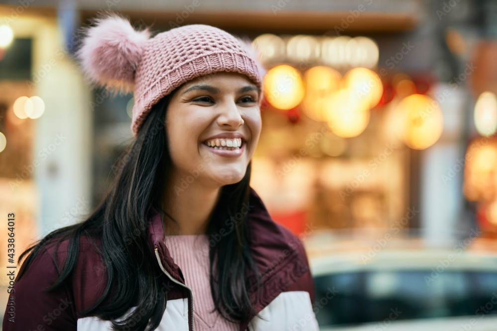 Young hispanic girl smiling happy standing at the city. Young hispanic girl smiling happy standing at the city.