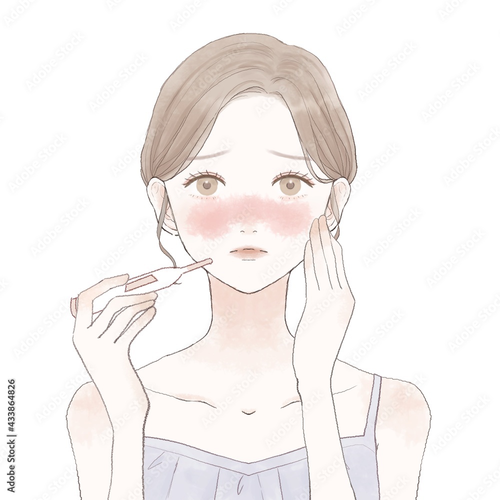 体温計で熱を測る女性