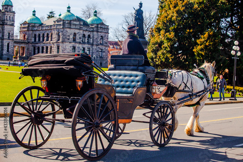 Victoria, British Columbia Canada - March 2016: Tourists enjoy their horse-drawn carriage ride in Victoria, B.C. CANADA