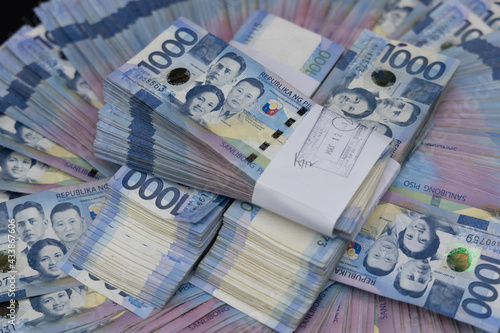 Canvas Print A pile of one thousand Philippines peso banknotes