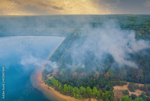 Panorama aerial wildfire is burning trees dry grass in the forest. © ungvar