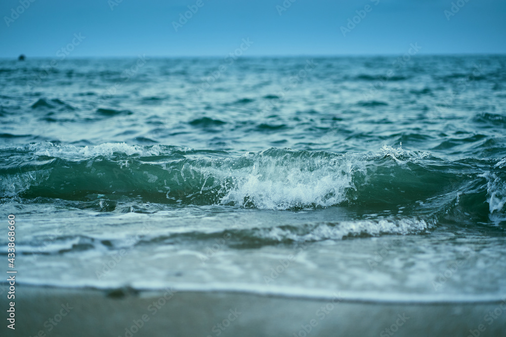 Beautiful waves of sea, light blue sea water color at Phayun Beach, Ban Chang, Rayong, Thailand.
