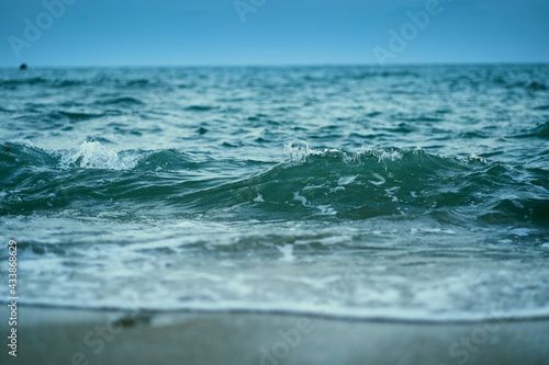 Beautiful waves of sea, light blue sea water color at Phayun Beach, Ban Chang, Rayong, Thailand. © pranchai