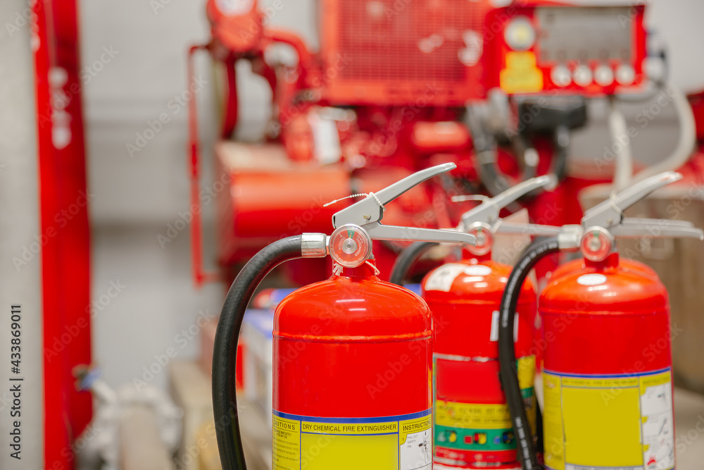 Inspection Fire extinguisher and fire hose,Ready to use in the event of a fire.Safety first concept. Inspection Fire extinguisher and fire hose,Ready to use in the event of a fire.Safety first concept.