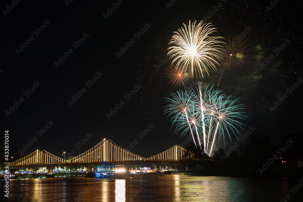 SURATTHANI, THAILAND - OCTOBER 17 : Beautiful firework display for celebration on the Tapee river on parades in Chak Phra Festival on October 17, 2015 in Suratthani, Thailand. SURATTHANI, THAILAND - OCTOBER 17 : Beautiful firework display for celebration on the Tapee river on parades in Chak Phra Festival on October 17, 2015 in Suratthani, Thailand.
