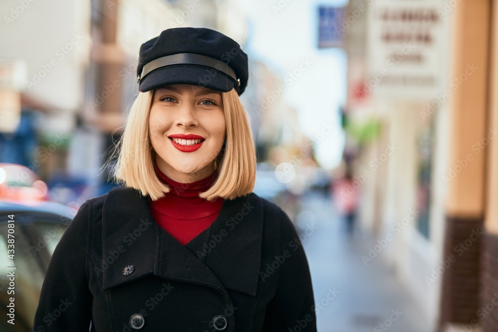 Young blonde woman smiling happy standing at the city. Young blonde woman smiling happy standing at the city.