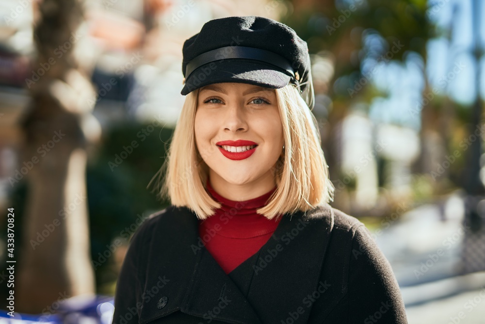 Young blonde woman smiling happy standing at the city. Young blonde woman smiling happy standing at the city.
