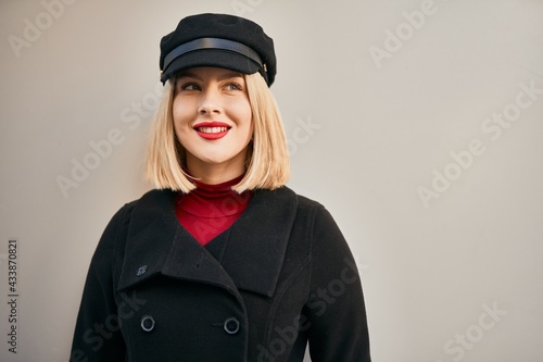 Young blonde woman smiling happy standing at the city. © Krakenimages.com