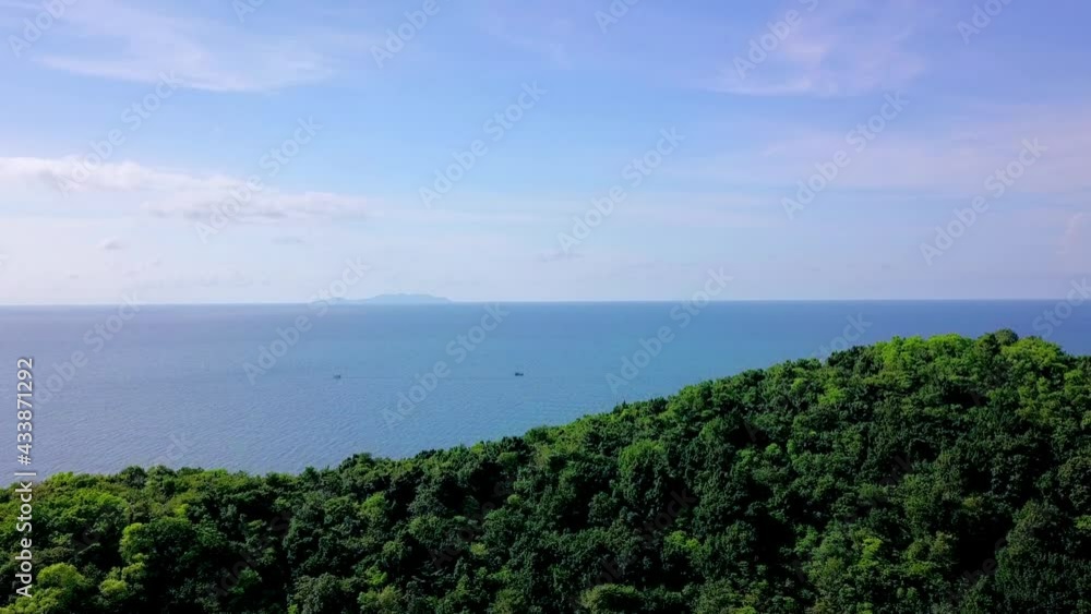 Aerial Shot passing over a Mountain towards the Blue sea, Koh Ma, Thailand. Aerial Shot passing over a Mountain towards the Blue sea, Koh Ma, Thailand.