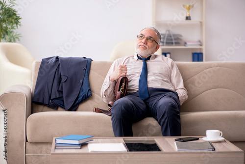 Old businessman employee waiting for business meeting