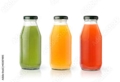 Foto Vegetable and fruits juice isolated on white background.