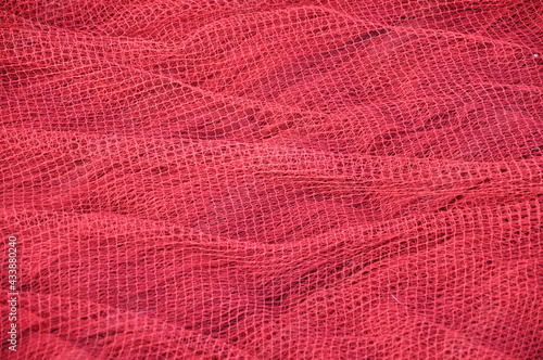 Red fishing Nets Textured Background. Fisher net close up. Colourfoul Fisher net close-up and details. 