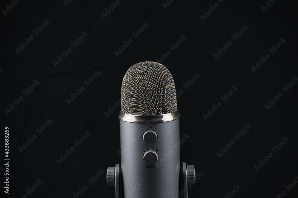 studio microphone for recording podcast on black background studio microphone for recording podcast on black background