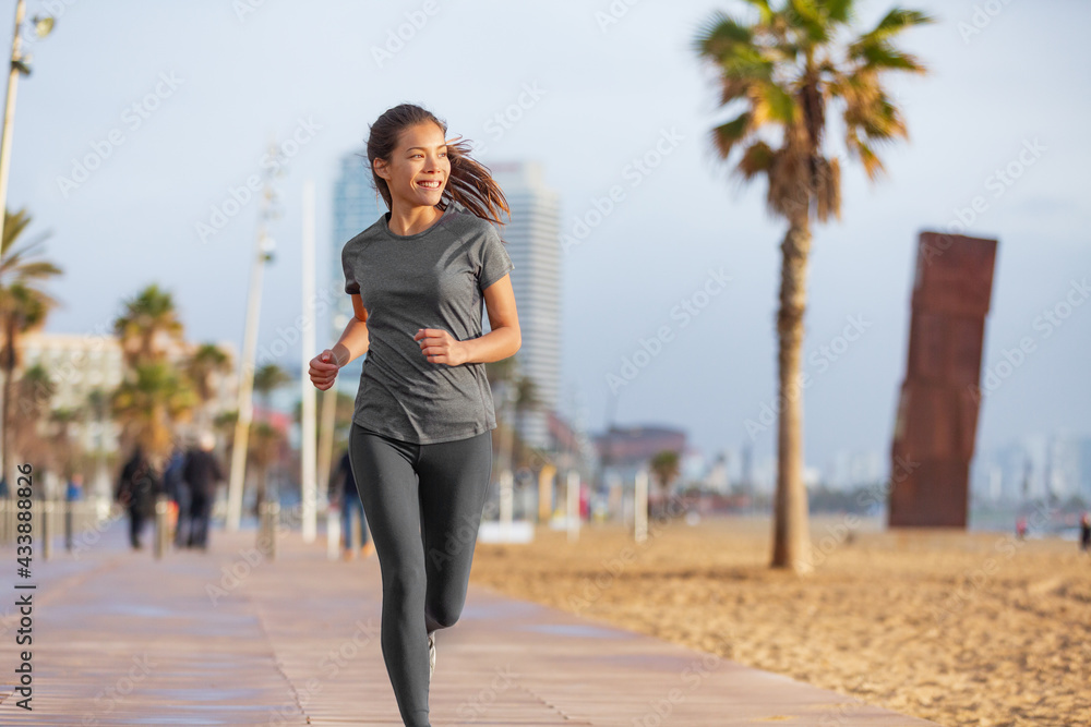 Running woman jogging on Barcelona Beach, Barceloneta. Healthy happy active  lifestyle biracial Asian girl runner training. Mixed race fitness woman  working out outside in Catalonia, Spain. Stock Photo | Adobe Stock