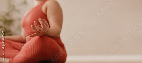 Fitness woman sitting in meditation
