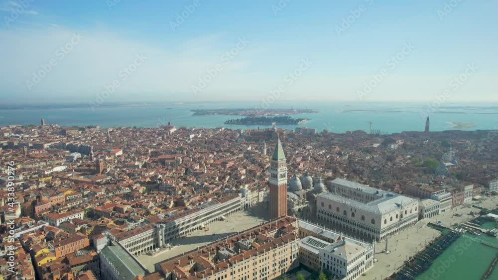 Venice: Aerial view of famous St Mark's Square (Piazza San Marco), St Mark's Basilica and Doge's Palace in historic center of city, clear blue sky - landscape panorama of Italy from above, Europe. Venice: Aerial view of famous St Mark's Square (Piazza San Marco), St Mark's Basilica and Doge's Palace in historic center of city, clear blue sky - landscape panorama of Italy from above, Europe.