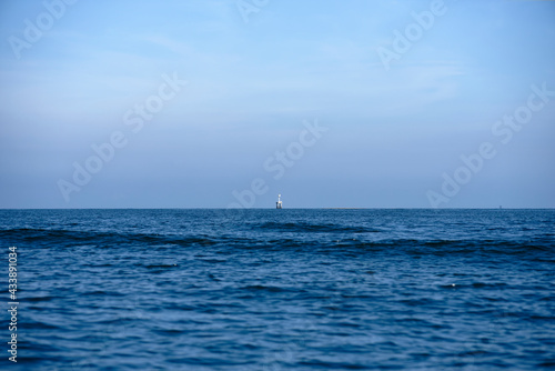 Minimal Ocean and sky with mysterious building