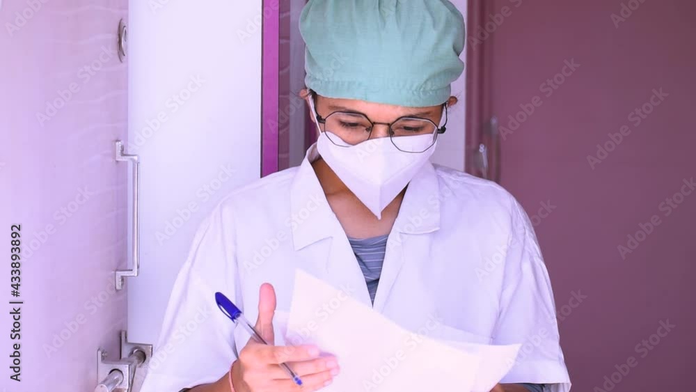 Angry doctor throws away papers. Furious female doctor throwing