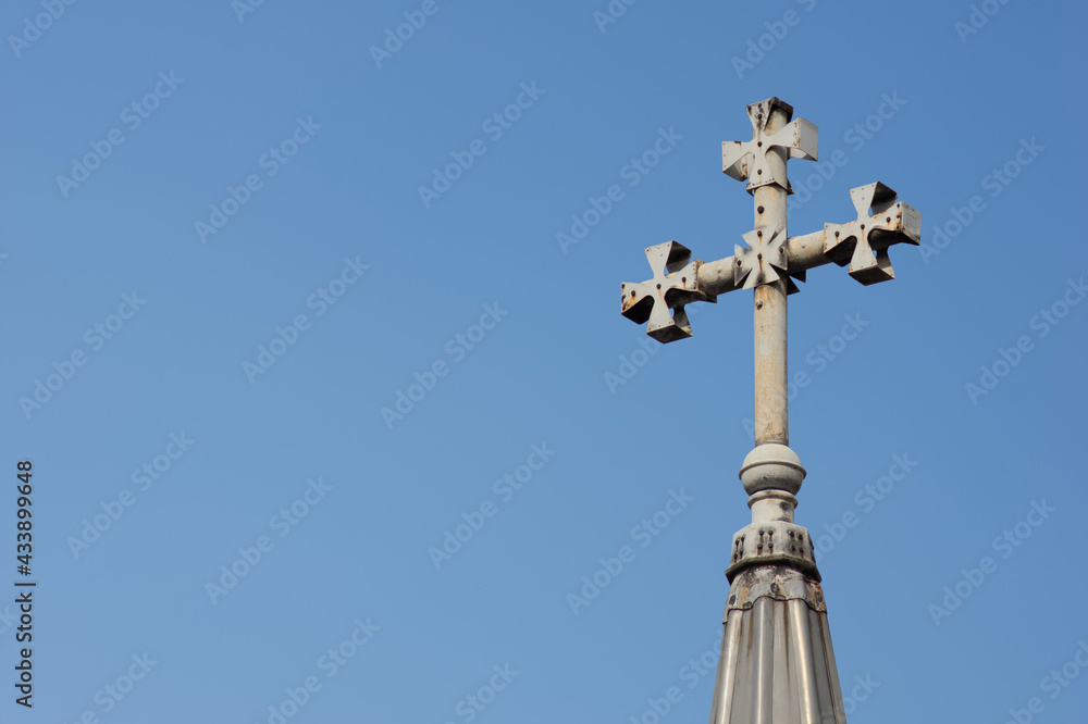 Close-up of a Cross on a Christian church on blue background