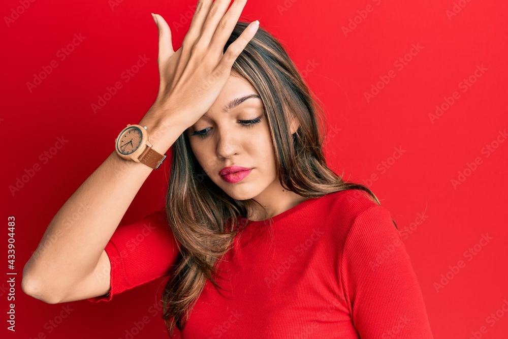 Young brunette woman wearing casual clothes surprised with hand on head for mistake, remember error. forgot, bad memory concept. Young brunette woman wearing casual clothes surprised with hand on head for mistake, remember error. forgot, bad memory concept.