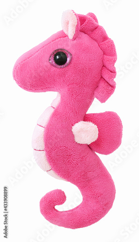 Homemade pink seahorse plushie toy. Isolated on white background without shadow. Hippocampus plaything on white bg. Sea horse on white. Stuffed spotted seahorse. Childish coral seahorse imitation. photo